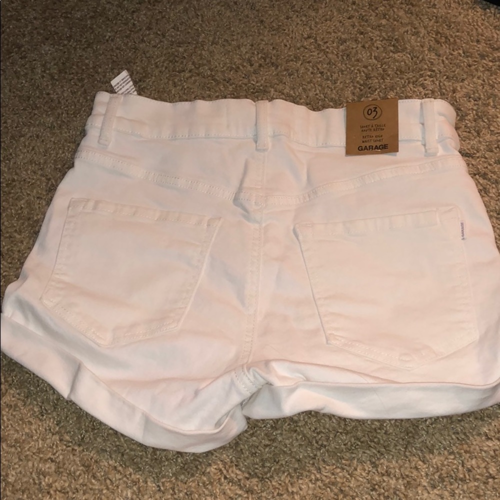 White distressed jean shorts